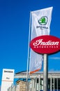 Skoda dealership big signs and flag together with Indian Motorcycle sign