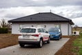 The Skoda Kodiaq SUV car of the ReMax real estate company after successful sale of newly built bungalow house by a young family