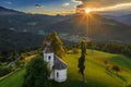 Skofja Loka, Slovenia - Aerial view of the beautiful hilltop Sveti Tomaz Saint Thomas church with an amazing sunset Royalty Free Stock Photo