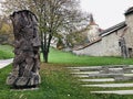 Wood carving art stands out in front of the Loka Castle uphill walkway in Skofja Loka, Slovenia. Royalty Free Stock Photo