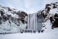 SKOGAFOSS/ICELAND - FEB 02 : View of Skogafoss Waterfall in Winter on Feb 02, 2016. Unidentified people Royalty Free Stock Photo