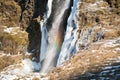 Skogafoss, Skoga waterfall and rainbow in winter in Iceland Royalty Free Stock Photo