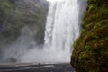 Skogafoss Waterfall and Moss Colored Cliffs Royalty Free Stock Photo