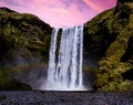 Skogafoss Waterfall underneath the pink evening sky