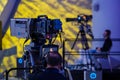 Unrecognizable man recording video on camera during conference Royalty Free Stock Photo