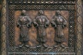 Bronze carving relief with three women figures in traditional M