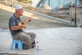 SKOPJE,MACEDONIA-AUGUST 29,2018:man plays music on a traditional stringed instrument,