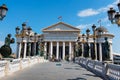 Skopje, Macedonia - August 26, 2017: Skopje Archeological museum with stone bridge with many monuments over Vardar river Royalty Free Stock Photo