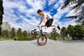 BMX Bike rider doing trick while jumping high