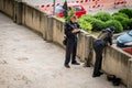 Two armed security officers taking a break.