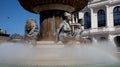 Statues and splashing water of fountain, monument representing the life of Alexander the great, Skopje city center on bright sunny