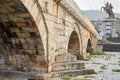 Skopje,Stone Bridge, low angle,towards steps with statue of warrior on horse in background