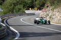 Skradin Croatia, June 2020 Green and black formula racecar seen from distance going uphill during a race championship