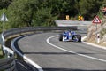 Skradin Croatia, June 2020 Green and black formula racecar seen from distance going uphill during a race championship