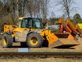 Skrunda, Latvia - April 20, 2022: JCB 550-80 Telehandler at the railway tracks