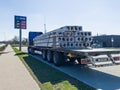 Skrunda, Latvia - April 22, 2022: A truck at a petrol station with concrete panels with holes