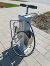 Skrunda, Latvia - May 2, 2022: Public bicycle service station with air pump, all necessary tools and repair kit