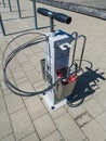 Skrunda, Latvia - May 2, 2022: Public bicycle service station with air pump, all necessary tools and repair kit