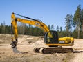 Skrunda, Latvia - May 3, 2022: Yellow excavator JCB JS 220 LC is located in a quarry