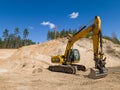 Skrunda, Latvia - May 3, 2022: Yellow excavator JCB JS 220 LC is located in a quarry