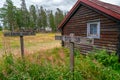 Skuleskogen, Sweden - 08.22.2021: Red wooden cabin in the forest of Skuleskogen national park in Sweden on a cloudy day