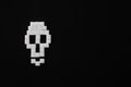 Skull bones from sugar on black background, flat lay.