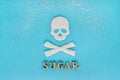 Skull bones sugar, scattering of granulated sugar, Text SUGAR, b