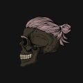 Skull with hair in a bun and tattoo.