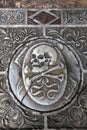 Skull on the medieval marble tomb, Pisa, Italy