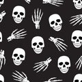Skull and skeleton hand seamless pattern on black background. halloween skull pattern background. Royalty Free Stock Photo