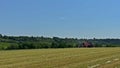 Skutec, Czech Republic, June 2, 2021: Harvesting silage on a tractor trailer using a tractor.