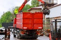 Skutec, Czech Republic, 28 May 2020: A grapple truck loads scrap industrial metal for recycling.