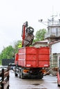 Skutec, Czech Republic, 28 May 2020: A grapple truck loads scrap industrial metal for recycling.