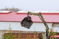 Skutec, Czech Republic, 21 November 2019: A grapple truck loads scrap industrial metal for recycling.