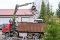 Skutec, Czech Republic, 21 November 2019: A grapple truck loads scrap industrial metal for recycling.