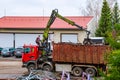 Skutec, Czech Republic, 21 November 2019: A grapple truck loads scrap industrial metal for recycling.