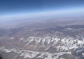 The sky above looked down at the endless snow-capped mountains