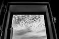 Sky with altocumulus floccus clouds through the window Royalty Free Stock Photo