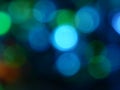 Defocused bokeh circle green and blue night lights background texture. Royalty Free Stock Photo