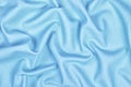 Sky blue woolen crumpled wrinkled fabric with waves