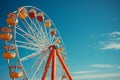 Sky bound joyride Ferris Wheel spins against the clear blue sky