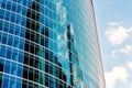 Sky and buildings are reflected in the office skyscraper facade Royalty Free Stock Photo