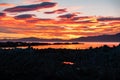 Sky burning with majestic clouds and orange sunset on the sea, Kaikoura, South Island, New Zealand Royalty Free Stock Photo