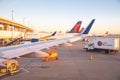 Sky Chefs airline catering, airfield operations to Delta Air Lines aircrafts Dallas-Fort Worth DFW airport early morning, one of Royalty Free Stock Photo