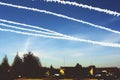 sky chemtrails over village . AI generated Royalty Free Stock Photo