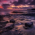 The sky clears after a rain storm just long enough to show the deep red and purple clouds over the South Dorset jurassic coastline Royalty Free Stock Photo