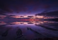 The sky clears after a rain storm just long enough to show the deep red and purple clouds over the South Dorset jurassic coastline Royalty Free Stock Photo