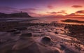 The sky clears after a rain storm just long enough to show the deep red and purple clouds over the South Dorset jurassic coastline Royalty Free Stock Photo