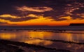 The sky clears after a rain storm just long enough to show the deep red and purple clouds over the South Dorset jurassic coastline Royalty Free Stock Photo