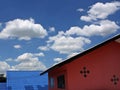 The sky and a cloud drift the top of house roof ,